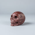 Handgesneden schedel carving van rode jaspis met unieke aders